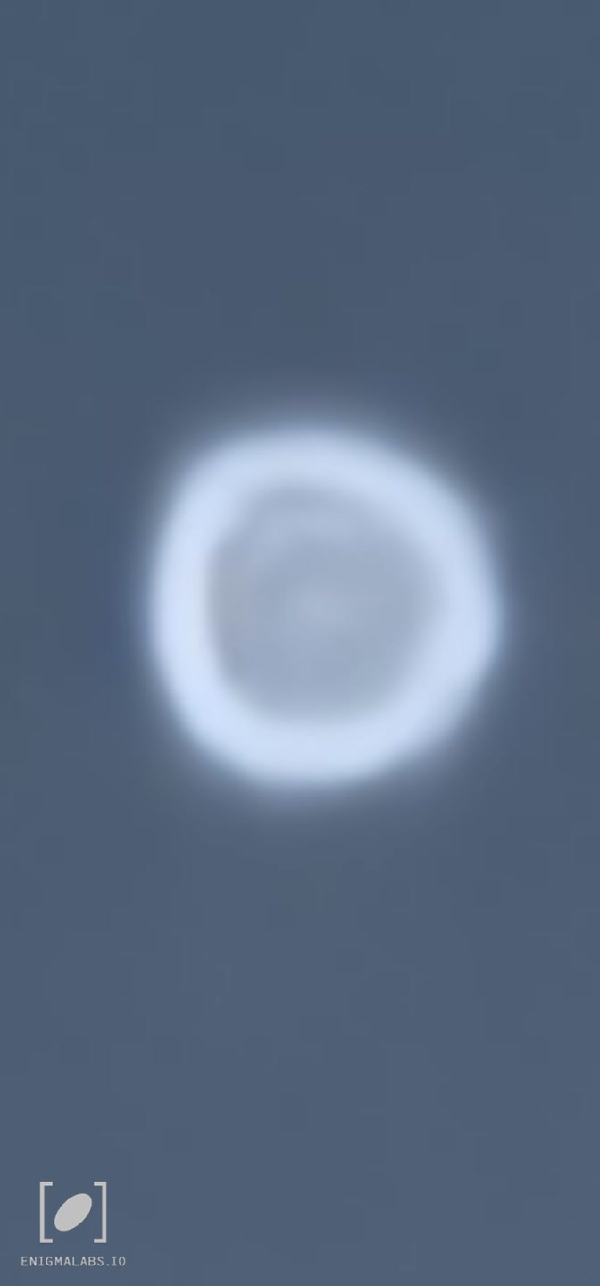 White hovering shape moving slowly