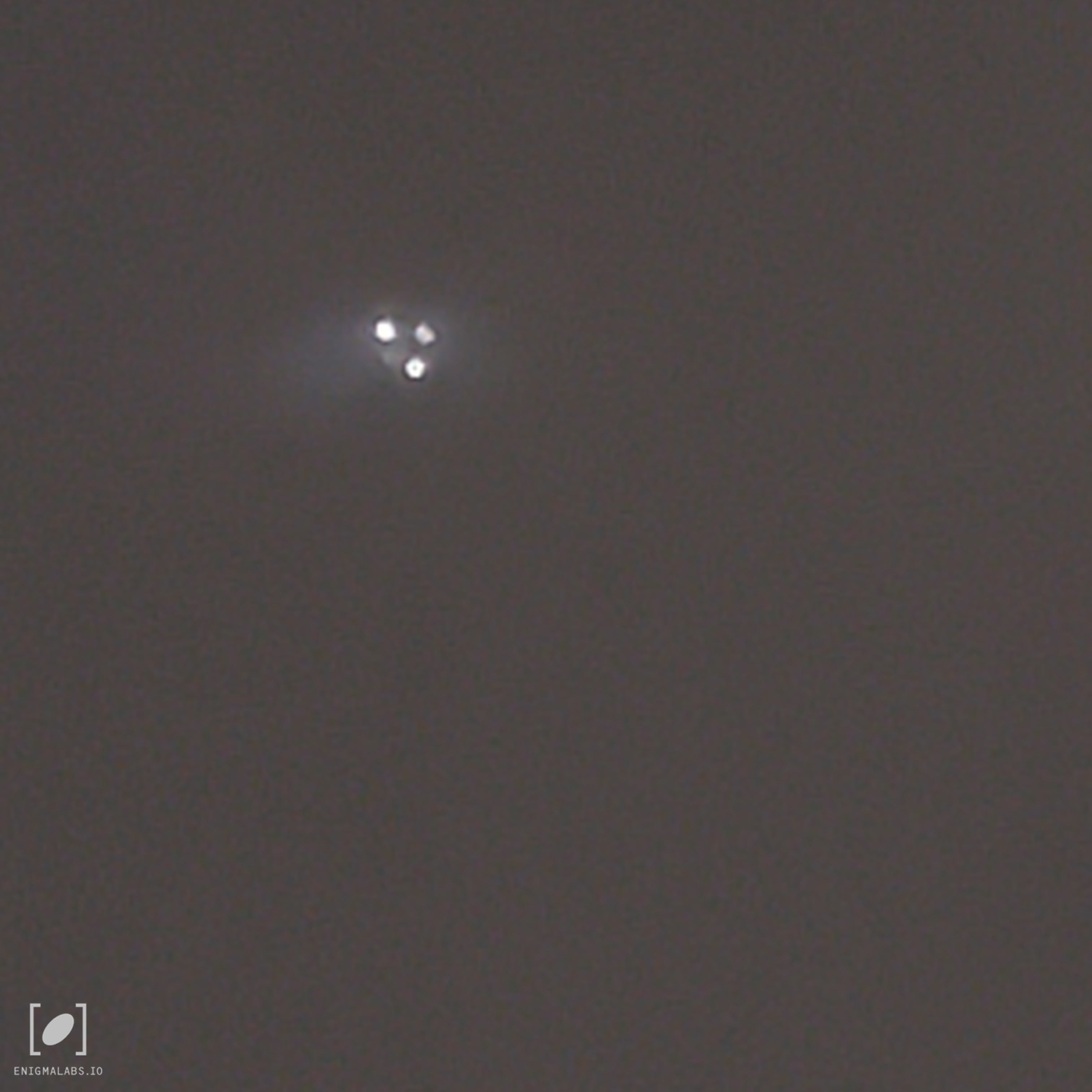Three lights moving diagonally then hovering above house
